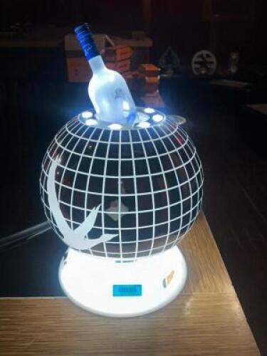DESCRIPTION GREY GOOSE LED LIGHTED GLOBE BOTTLE PRESENTER. LOCATION VIP STAGE QTY 1