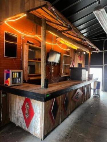 DESCRIPTION 17' U SHAPED STONE TOP TIKI BAR W/ AWNING AND BACK BAR WALL CABINETS. ADDITIONAL INFORMATION EQUIPMENT IS NOT INCLUDED IN THIS LOT. TOOLS