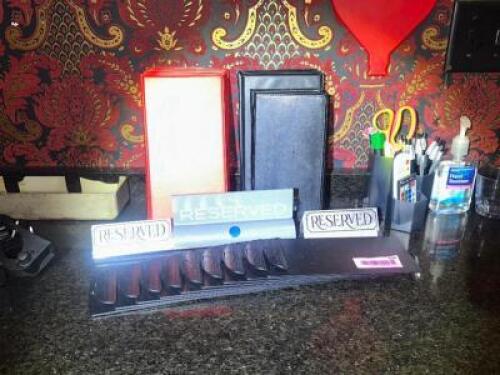 DESCRIPTION MISC CHECK PRESENTERS, RESERVE SIGNS, AND OFFICE SUPPLIES. LOCATION BACK BAR QTY 1