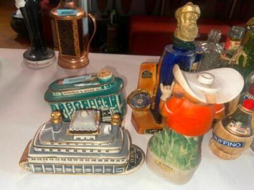 DESCRIPTION (1) LOT OF 4 ASSORTED COLLECTABLE BOTTLES AND DECANTERS. ADDITIONAL INFORMATION EMPTY THIS LOT IS: ONE MONEY LOCATION MAIN BAR QTY 1