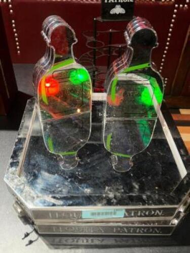DESCRIPTION (2) PATRON STAINLESS BOTTLE TRAYS AND PRESENTERS. THIS LOT IS: ONE MONEY LOCATION BACK BAR QTY 1