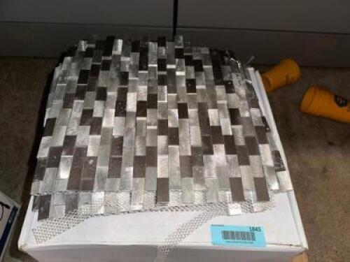 DESCRIPTION 1.5 BOXES OF GREY AND WHITE TILE MOSAIC BACK SPLASH THIS LOT IS: ONE MONEY SIZE 12" X 12" LOCATION OFFICE QTY 1