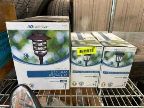 (3) BOX SET OF OF COURTYARD SOLAR POWER LANDSCAPE LIGHTS.