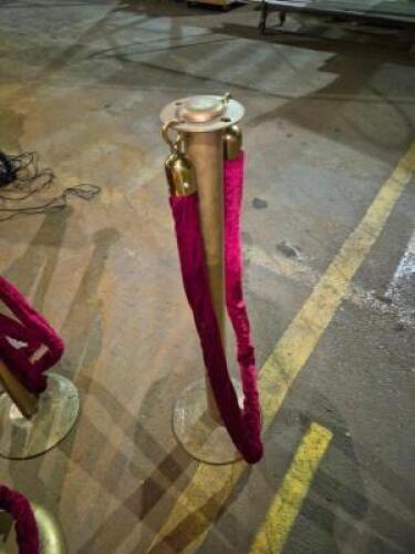 (3) - GOLD STANCHIONS WITH RED VELVET ROPE