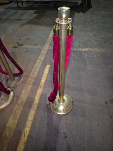 (4) - GOLD STANCHIONS WITH RED VELVET ROPE