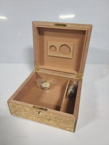 DESCRIPTION: (2) CIGAR HUMIDOR BRAND/MODEL: INCLUDES HUMIDIFIER AND HYGROMETER INFORMATION: TAN / BROWN PATTERN QTY: 2