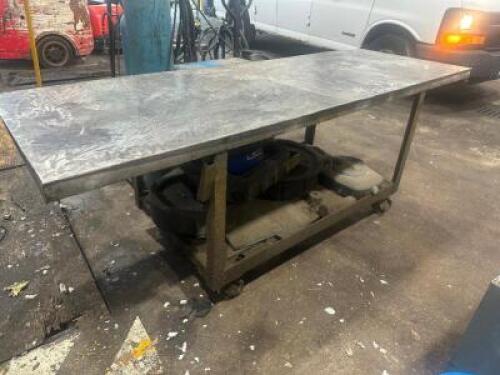 94" X 31" STEEL FABRICATION TABLE ON CASTERS.