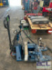 ELECTRIC HYDRAULIC OIL PUMP W/ MOUNTED PALLET JACK.