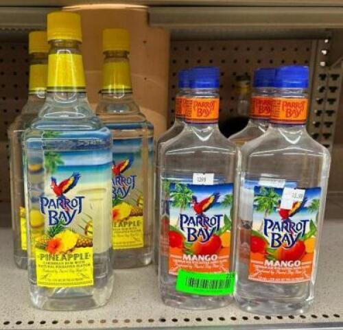 (3) BOTTLES OF PINEAPPLE RUM AND (4) BOTTLES OF MANGO RUM