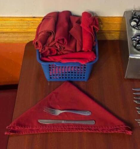 BASKET OF WRAPPED SILVERWARE