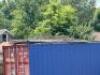 SCAFOLDING CONTENTS ON TOP OF CONTAINER