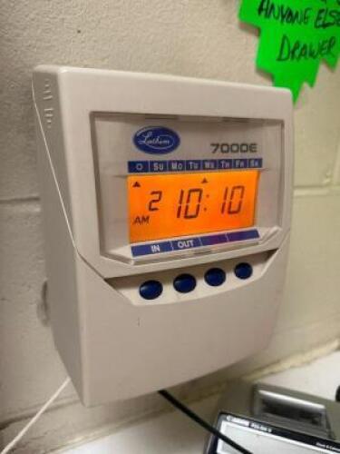 DESCRIPTION LATHEM 7000E DIGITAL TIME CLOCK W/ TRAY CARD RACK. LOCATION BREAK ROOM QTY 1