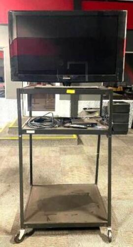 DESCRIPTION: SAMSUNG 40" LCD 1080P HDTV W/ MOBILE ELECTRONIC CART BRAND/MODEL: SAMSUNG LN-T4065F LOCATION: DINING AREA QTY: 1