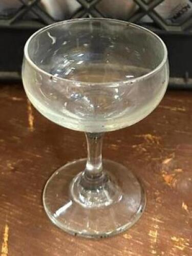 DESCRIPTION: (77) CHAMPAGNE GLASSES WITH (3) GLASS RACKS LOCATION: BANQUET HALL QTY: 77