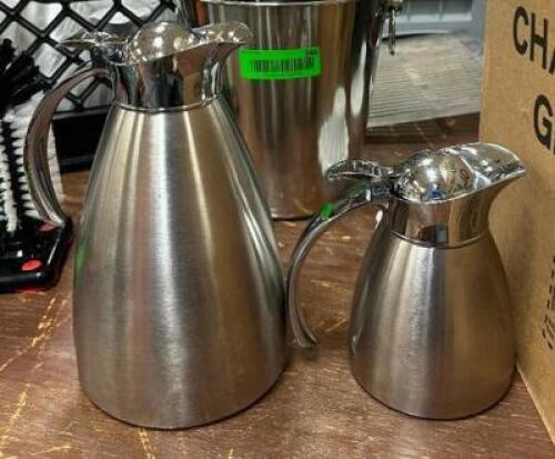 DESCRIPTION: (2) LARGE AND (4) SMALL STAINLESS CARAFES LOCATION: BANQUET HALL QTY: 6