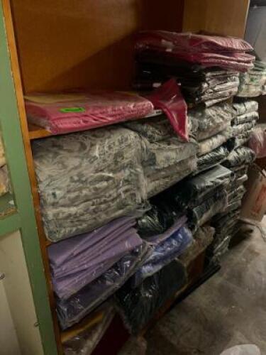 DESCRIPTION CONTENTS OF SHELF - ASSORTED LINENS, CHAIR COVERS, AND TABLE SKIRTS ADDITIONAL INFORMATION ASSORTED COLORS AND SIZES THIS LOT IS: ONE MONE