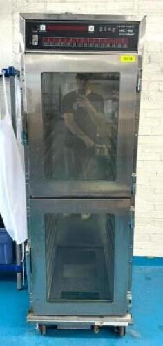 DESCRIPTION: HEATED DOUBLE-SIDED SMARTHOLD GLASS-DOOR CABINET ON CASTERS BRAND/MODEL: HENNY PENNY HHC-90 LOCATION: KITCHEN QTY: 1