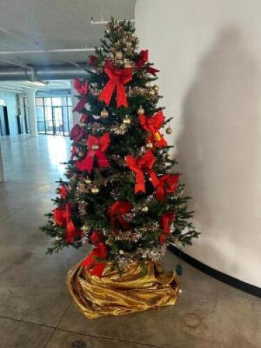 DESCRIPTION 9' CHRISTMAS TREE ADDITIONAL INFORMATION W/ DECORATIONS. LOCATION FLOOR 6 QTY 1