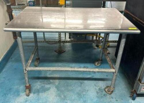 DESCRIPTION: 4' STAINLESS STEEL TABLE ON CASTERS SIZE: 48"X30"X36" LOCATION: KITCHEN QTY: 1