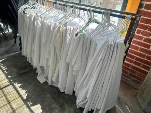 DESCRIPTION CONTENTS OF RACK (20) ASSORTED TABLE CLOTHES AND SKIRTS. THIS LOT IS: ONE MONEY LOCATION FLOOR 7 QTY 1