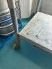 DESCRIPTION: 12' STAINLESS STEEL TABLE WITH RISER AND UNDERSHELF ON CASTERS SIZE: 144"X36"X36" LOCATION: KITCHEN QTY: 1 - 5